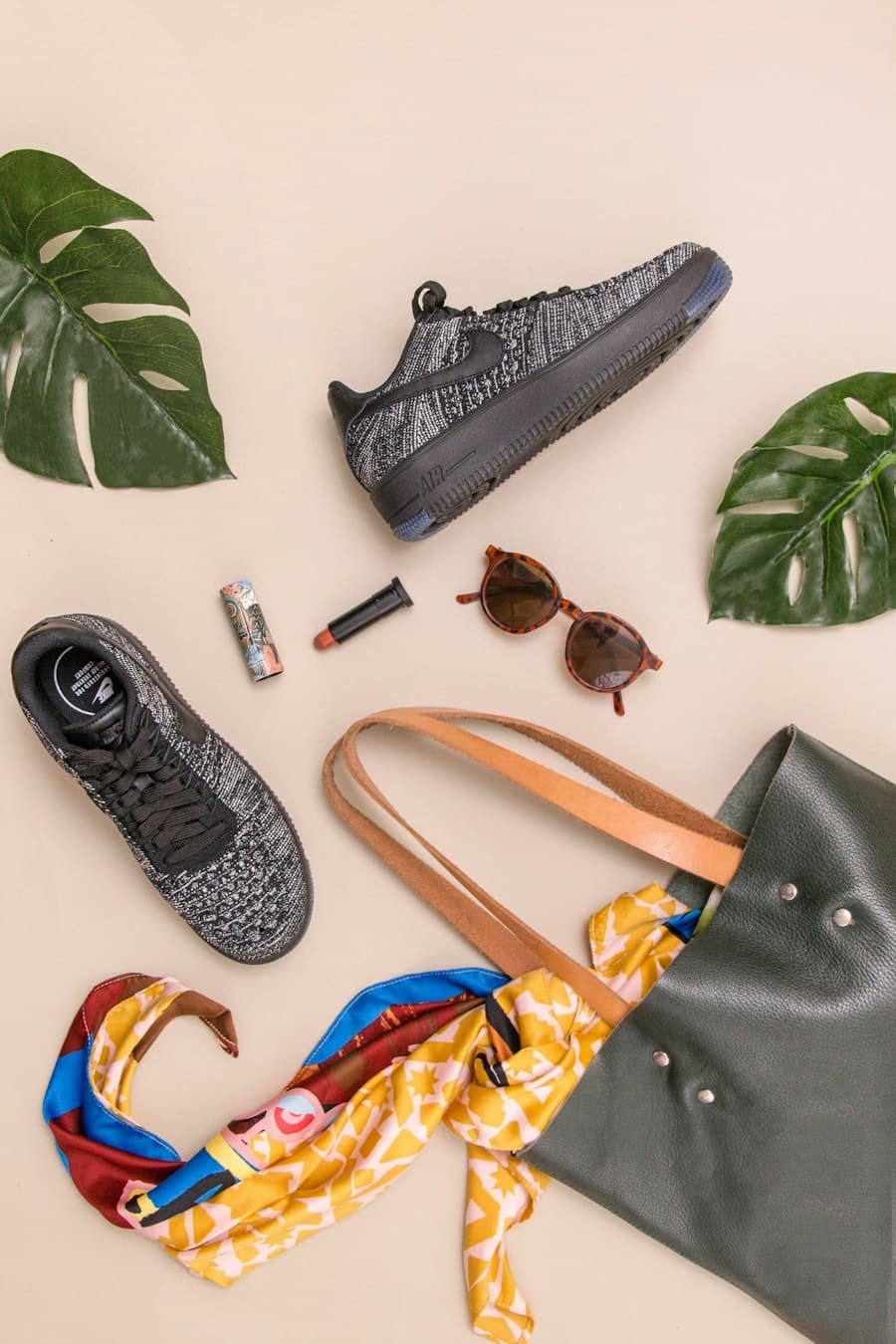 Sunglasses, bag and accessories flat-lay
